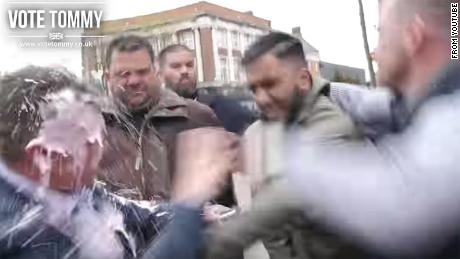 A grab from a Tommy Robinson promotional video on Youtube shows Robinson getting &#39;milkshaked.&#39;