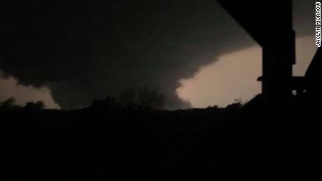 The wedge tornado that tore through Jefferson City is illuminated by a lightning strike Wednesday night.