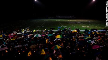 Mourners at a community vigil at Newtown High School for the victims of the mass shooting at Marjory Stoneman Douglas High School in Parkland, Florida in 2018.