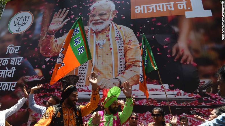 BJP supporters celebrate the election results outside the party&#39;s headquarters in Mumbai.