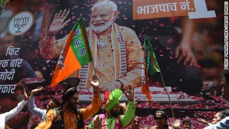 BJP supporters celebrate the election results outside the party&#39;s headquarters in Mumbai.