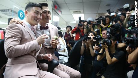 Marc and Shane register their marital status and receive new identification cards on May 24 in Taipei, Taiwan. 