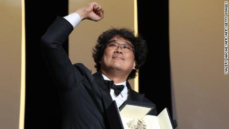 South Korean director Bong Joon-Ho celebrates on stage with his trophy after he was awarded with the Palme d&#39;Or for the film &quot;Parasite (Gisaengchung)&quot; on May 25, 2019 during the closing ceremony of the 72nd edition of the Cannes Film Festival in Cannes, southern France. (Photo by Valery HACHE / AFP)        (Photo credit should read VALERY HACHE/AFP/Getty Images)