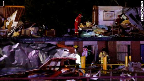 Emergency workers check what is left of the second floor of a hotel in El Reno.