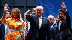 YOKOSUKA, JAPAN - MAY 28: U.S. President Donald Trump, First Lady Melania Trump and Japan&#39;s Prime Minister Shinzo Abe waves after delivering a speech to Japanese and U.S. troops as they aboard Japan Maritime Self-Defense Force&#39;s (JMSDF) helicopter carrier DDH-184 Kaga at JMSDF Yokosuka on May 28, 2019 in Yokosuka, Kanagawa, Japan. U.S President Donald Trump is on a four-day state visit to Japan, the first official visit of the Reiwa era.  (Photo by Athit Perawongmetha - Pool/Getty Images)