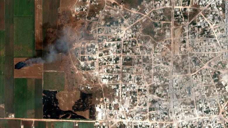 Plumes of thick black smoke from fires can be seen over the village of Hbit on Saturday.