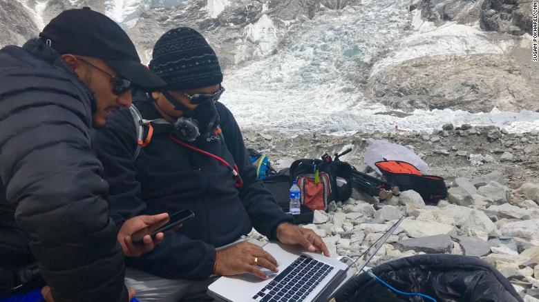 CNN cameraman Rajesh Mishra is seen wearing oxygen mask.