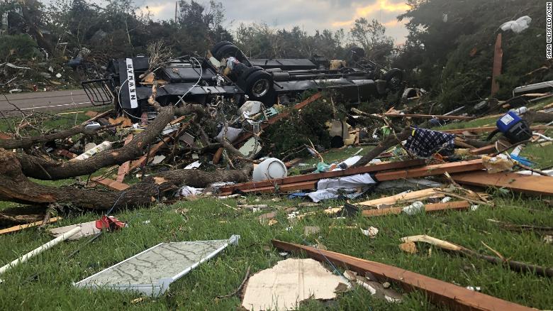 The tornado near Linwood wrecked homes and trees, and flipped this RV.