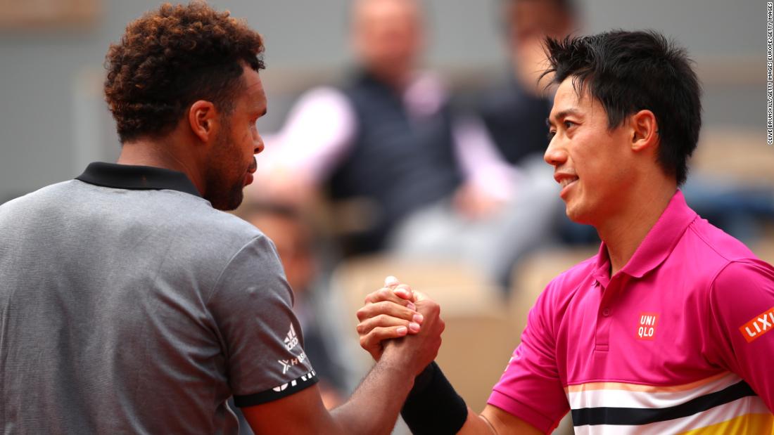 And in a battle of former grand slam finalists, Kei Nishikori (right) beat home hope Jo-Wilfried Tsonga in four sets. 