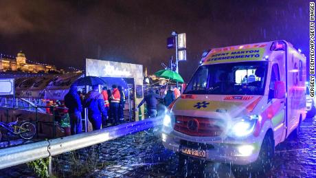 Rescue workers gather at the bank of the Danube River in downtown Budapest.