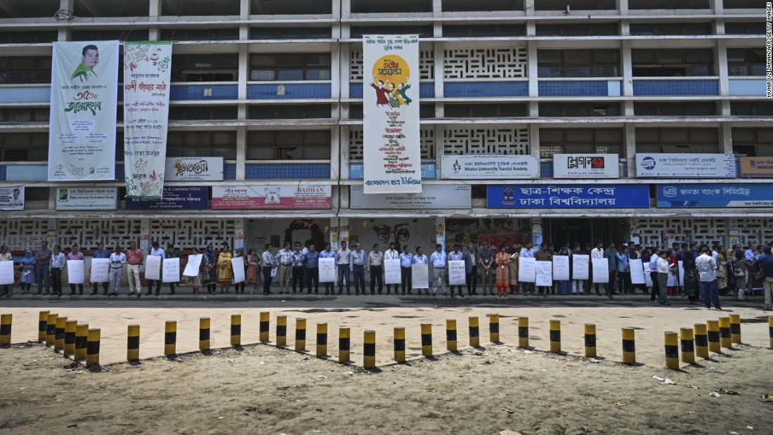 Members of the Transparency International Bangladesh group stand in a human chain during a protest in Dhaka on April 21, 2019, following Nusrat Jahan Rafi's murder.