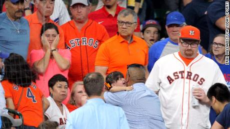 A young fan is taken to receive medical attention after being hit by a foul ball by Chicago Cubs outfielder Albert Almora Jr. 