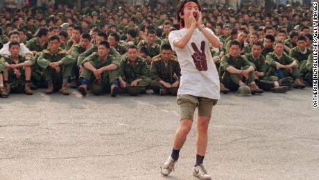 A student asks soldiers to go home as protesters continue in central Beijing, on June 3, 1989.  