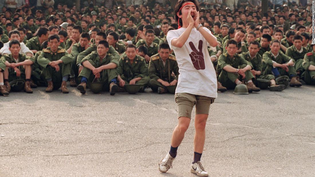 A student asks soldiers to go back home as protesters continue in central Beijing, on June 3, 1989. 
