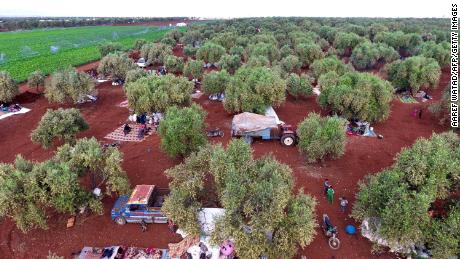 Syrians gathering in a field near a camp for displaced people in the village of Atme, Idlib earlier in May.