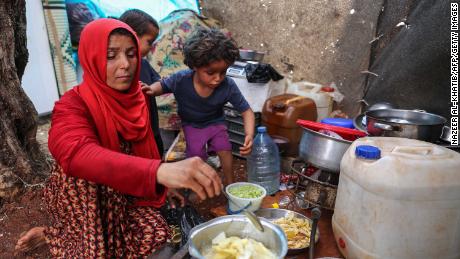 Displaced Syrian mother Mona Mutayr prepares an iftar meal in Atme during the Muslim holy fasting month of Ramadan.