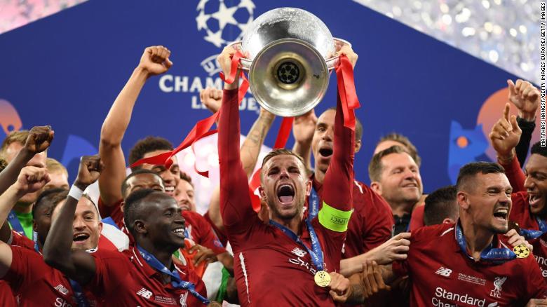 Jordan Henderson of Liverpool lifts the Champions League trophy after winning the UEFA Champions League Final between Tottenham Hotspur and Liverpool at Estadio Wanda Metropolitano on June 01, 2019 in Madrid.