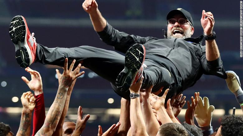 Liverpool manager Jurgen Klopp is thrown in the air as he celebrates with his players and staff after winning the Champions League final against Tottenham Hotspur in Madrid on Saturday. 