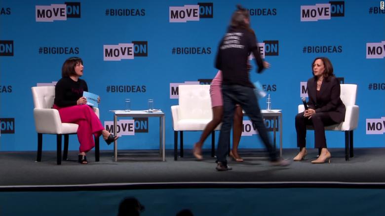Protester grabs Kamala Harris' microphone on stage