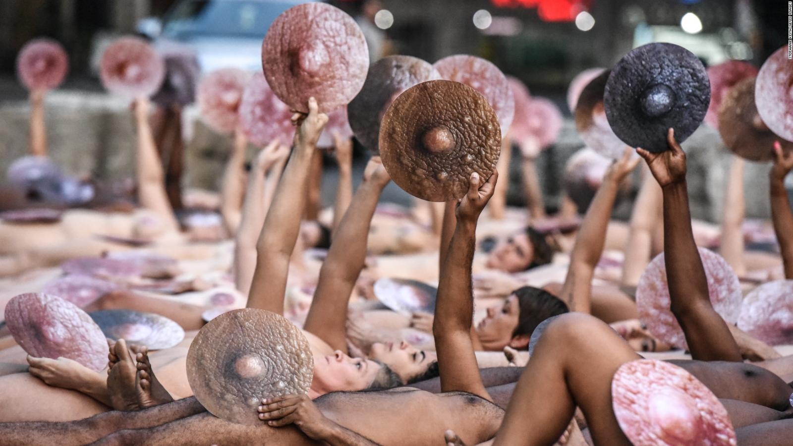 Spencer Tunick photoshoot: Demonstrators bare nipples outside Facebook HQ in  censorship protest - CNN Style