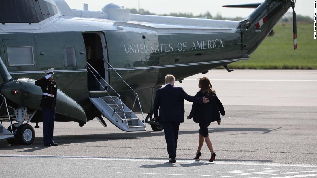 The Trumps walk toward Marine One after arriving at London&#39;s Stansted Airport on June 3.