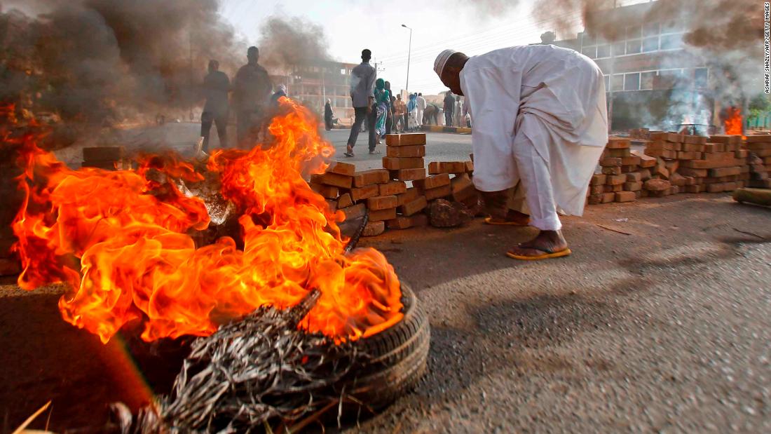 Protesters block a street with bricks and burning tires as military forces attempt to disperse a sit-in outside the army headquarters in Khartoum, Sudan, on Monday, June 3. More than &lt;a href=&quot;https://edition.cnn.com/2019/06/05/africa/sudan-death-toll-intl/index.html&quot; target=&quot;_blank&quot;&gt;100 protesters were killed&lt;/a&gt; when the military opened fire to break up the sit-in, according to a local doctors&#39; union.