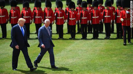 Trump&#39;s UK visit gets off to a booming start with guns, guards and insults