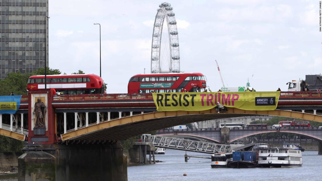 Amnesty International installs &quot;Resist Trump&quot; banners on Vauxhall Bridge in London.