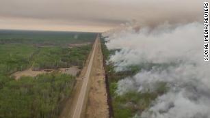 Smoke rises from a wildfire in High Level, Alberta, Canada, on May 22.