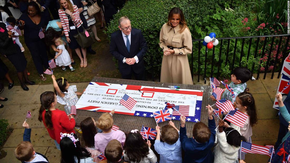 Philip May and Melania Trump attend a garden party at No. 10 Downing Street. 