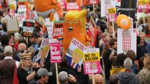 Anti-Trump protesters hold placards and balloons depicting US President Donald Trump as an orange baby as they gather in Trafalgar Square during a demonstration against the US State Visit in central London on June 4, 2019 the second day of the visit. - US President Donald Trump turns from pomp and ceremony to politics and business on Tuesday as he meets Prime Minister Theresa May on the second day of a state visit expected to be accompanied by mass protests. (Photo by ISABEL INFANTES / AFP)        (Photo credit should read ISABEL INFANTES/AFP/Getty Images)