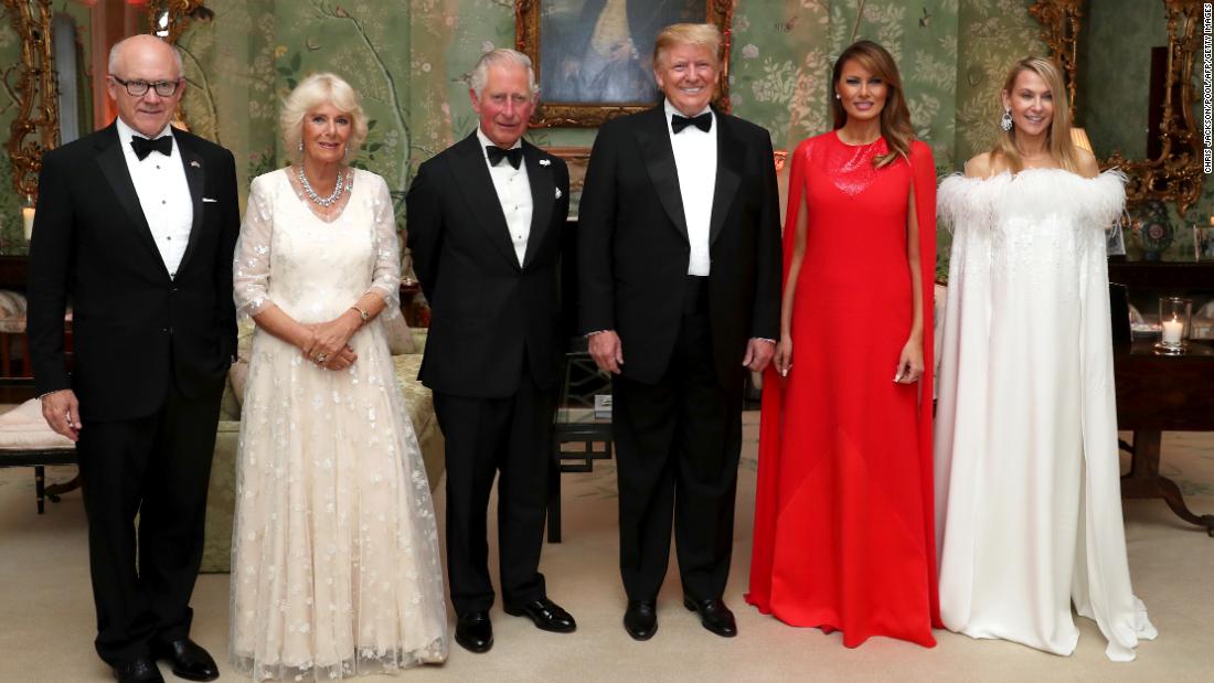 The Trumps pose for a photo ahead of a dinner at Winfield House in London on Tuesday, June 4. Joining them, from left, are Woody Johnson, the US ambassador to the United Kingdom; Camilla, the Duchess of Cornwall; Prince Charles; and Johnson&#39;s wife, Suzanne Ircha.