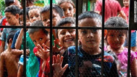 Migrant children line up for a meal at the door of the Jesus del Buen Pastor del Pobre y el Migrante shelter, in Tapachula, Mexico, on May 30, 2019. Public opinion about immigraton has soured in parts of Mexico as the number of migrants coming to the country has increased. 