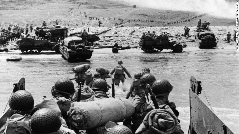 US assault troops and equipment landing on Omaha beach the day following D-Day