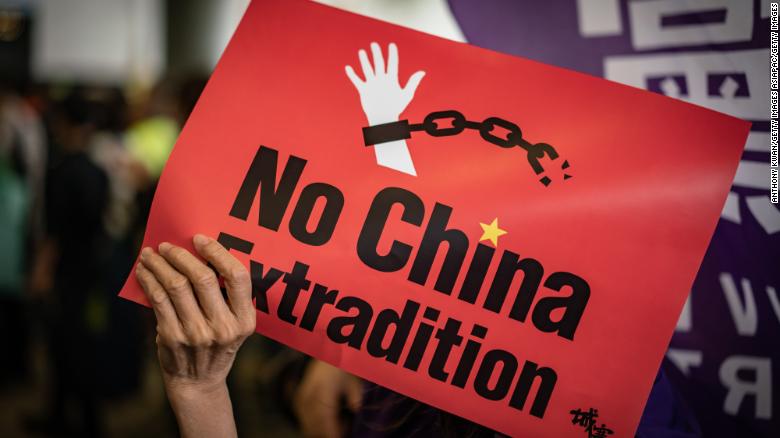 A protester holds a placard during a rally against the extradition law outside the Legislative Council building on May 4, 2019 in Hong Kong.