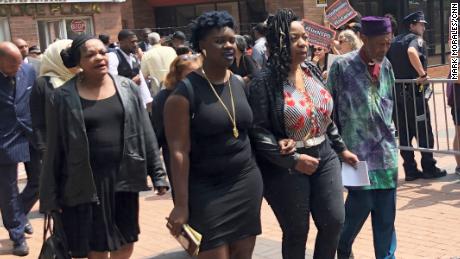 Garner&#39;s mother, Gwen Carr, second from right, leaves court flanked by family members Wednesday. 