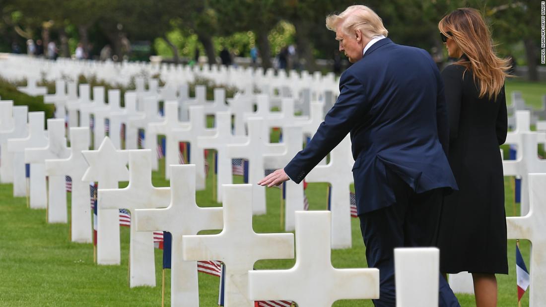 Trump and his wife, Melania, visit the graves of troops who died on D-Day.