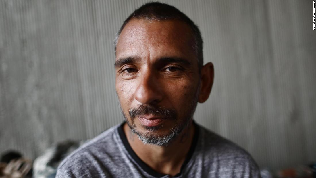 Travis Stanley, who said he has been homeless for three months and is a Navy veteran, poses for a portrait on June 5 beneath an overpass where he usually sleeps.