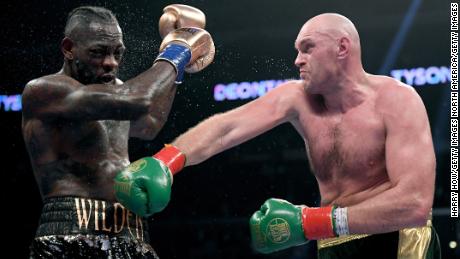 Tyson Fury punches Deontay Wilde in the seventh round fighting to a draw during the WBC Heavyweight Championship in December 2018.