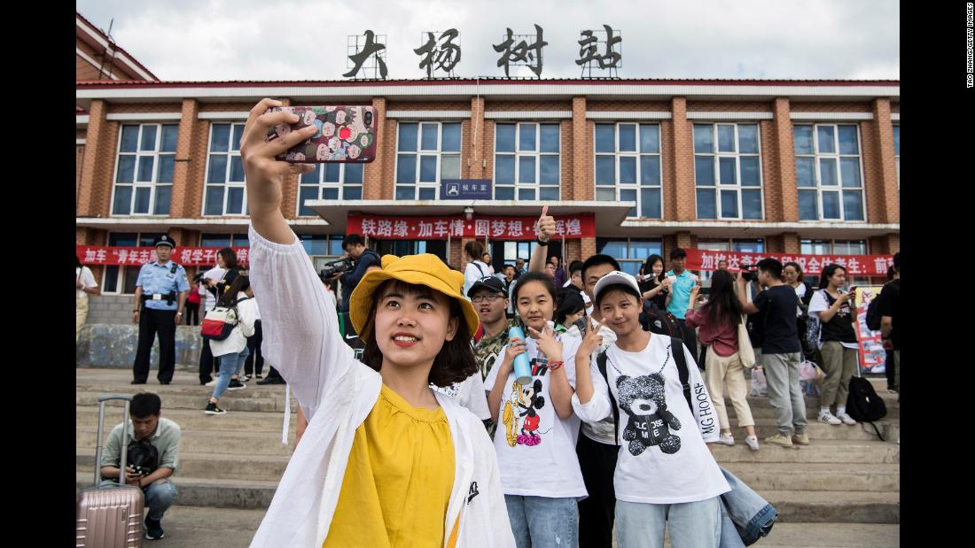 Students in Dayangshu township in Inner Mongolia on June 5, 2019, as they wait for a &quot;gaokao train.&quot; The train operates once a year and takes 450 students from Dayangshu to a town 135 kilometers (84 miles) away where they will sit their college entrance exam.