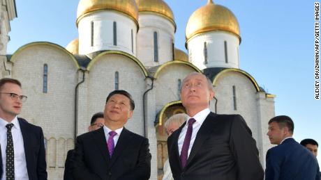 Russian President Vladimir Putin and his Chinese counterpart Xi Jinping tour the Kremlin following their talks, Moscow, June 5.