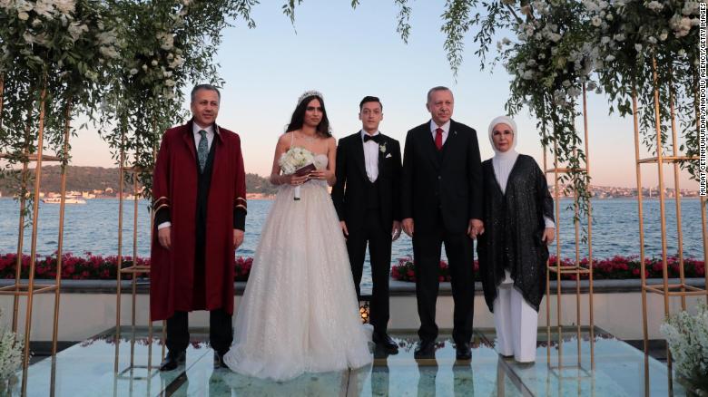 Turkish President Recep Tayyip Erdogan, second from right, and his wife Emine Erdogan attend the wedding ceremony Friday of footballer Mesut Ozil and Amine Gulse, along with the governor of Istanbul Ali Yerlikaya, far left. 