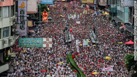 HONG KONG, HONG KONG - JUNE 09:  Protesters march on a street during a rally against the extradition law proposal on June 9, 2019 in Hong Kong China. Hundreds of thousands of protesters marched in Hong Kong in Sunday against a controversial extradition bill that would allow suspected criminals to be sent to mainland China for trial.(Photo by Anthony Kwan/Getty Images)