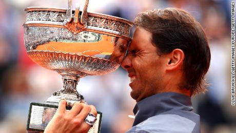 Rafael Nadal lifts the French Open trophy for the 12th time after his four-set victory over Dominic Thiem in Paris.