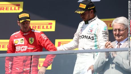 Sebastian Vettel reluctantly made his way to the podium after the stewards' decision at the Canadian GP.