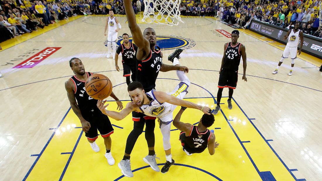 Curry is surrounded by Raptors during Game 3 on Wednesday, June 5. He scored 47 points, a playoff career-high, but it wasn&#39;t enough as the Raptors won 123-109.