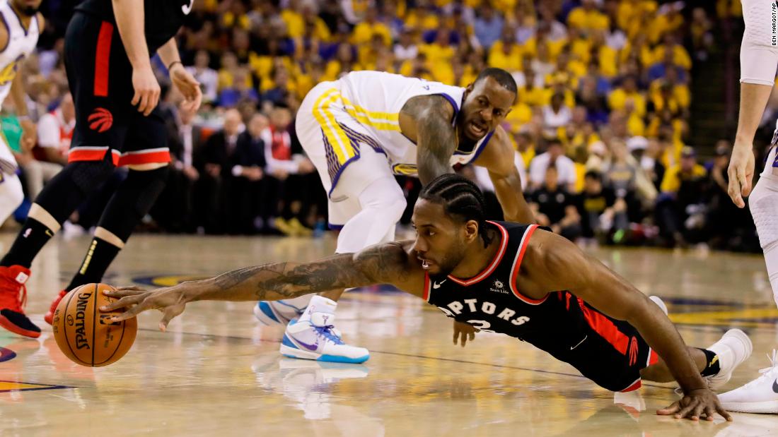 Leonard reaches for a loose ball during the first half of Game 3. He finished the game with 30 points, seven rebounds and six assists.