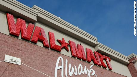 The Wal-Mart logo is displayed on the exterior of a Wal-Mart store January 8, 2009 in Oakland, California. Wal-Mart has posted weaker than expected same store sales for December and has lowered its fourth quarter earnings forecast to 91 cents to 94 cents $1.03 to $1.07 a share.  (Photo by Justin Sullivan/Getty Images)