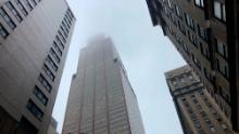 Mist and smoke cover the top of a building near 51st Street and 7th Avenue Monday, June 10, 2019, in New York, where a helicopter was reported to have crash landed on top of the roof of a building in midtown Manhattan.  (AP Photo/Mark Lennihan)