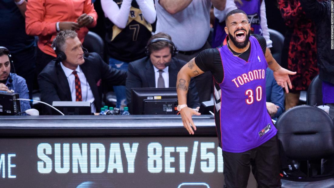 Rapper Drake, a huge Raptors fan who sits courtside and often jaws with opposing players, celebrates during Game 1. Curry&#39;s father, Dell, used to play for the Raptors, and Drake was wearing his jersey.